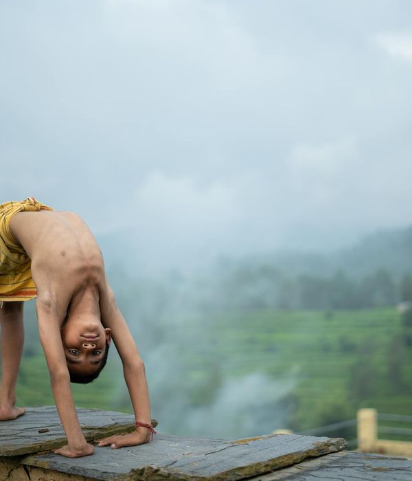 Person practicing a balancing pose in a calm environment.