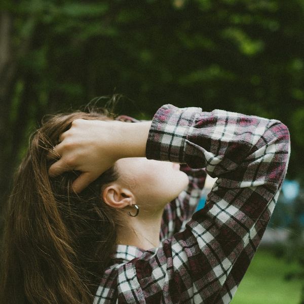 Woman feeling energized and full of life in nature.